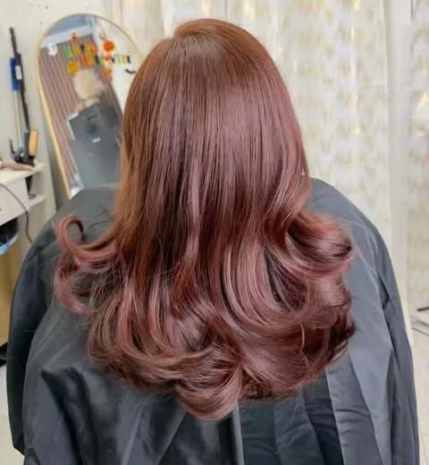Rich auburn color with soft, bouncy curls