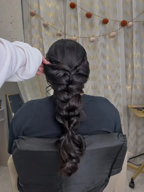 A loose, textured braid down the back