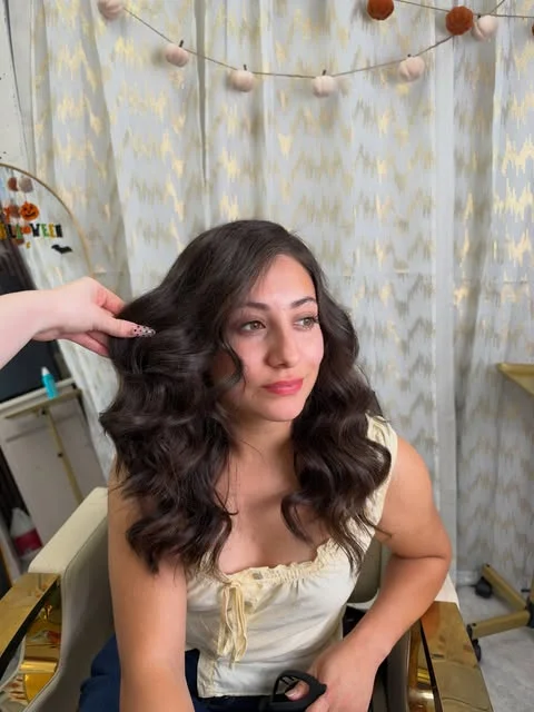 Soft dark curls, styled by hand